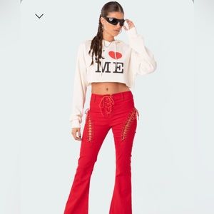 Red lace up flared jeans, sz L make the booty pop 😳